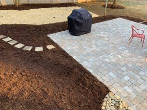 hardscape patio by Belgard with a mulch border